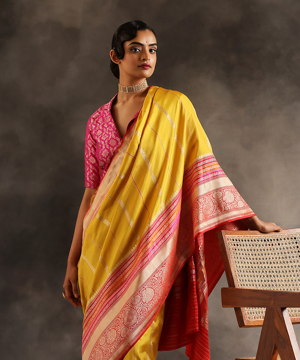 Handloom_Yellow_Pure_Katan_Silk_Ektara_Banarasi_Saree_With_Majenta_And_Orange_Kadhiyal_Border_WeaverStory_01