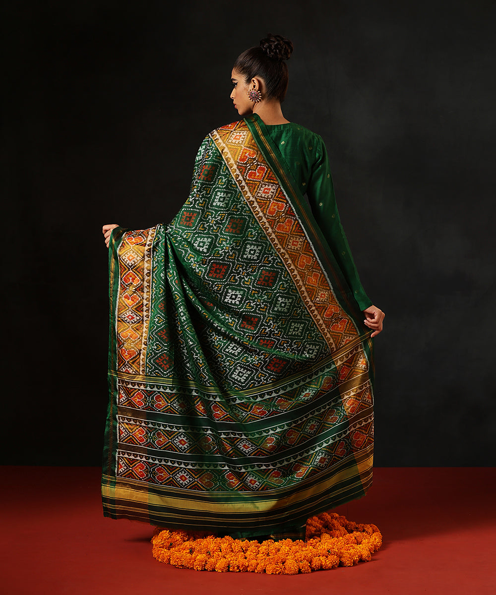 Dark_Green_Handloom_Pure_Mulberry_Silk_Single_Ikat_Patola_Saree_With_Mustard_TissueBorder_WeaverStory_03