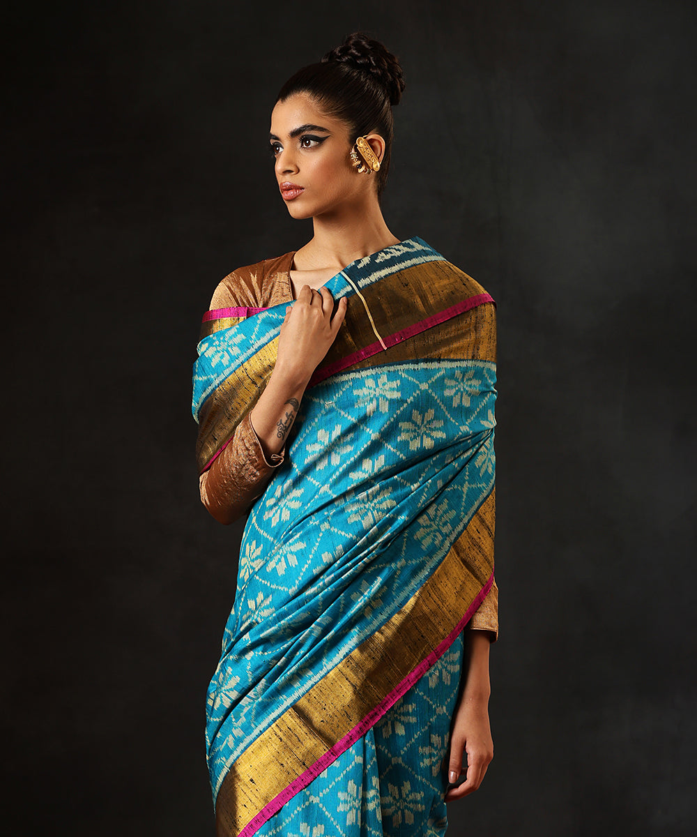 Aqua_Blue_Handloom_Raw_Silk_Single_Ikat_Patola_Saree_With_Gold_TissueBorder_WeaverStory_01