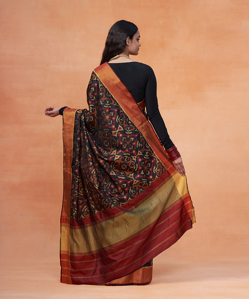 Handloom_Black_And_Maroon_Pure_Mulberry_Silk_Ikat_Patola_Saree_With_Zari_Border_WeaverStory_03