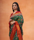Green_Handloom_Pure_Mulberry_Silk_Ikat_Patola_Saree_With_Yellow_And_Green_Geometrical_Pattern_WeaverStory_01