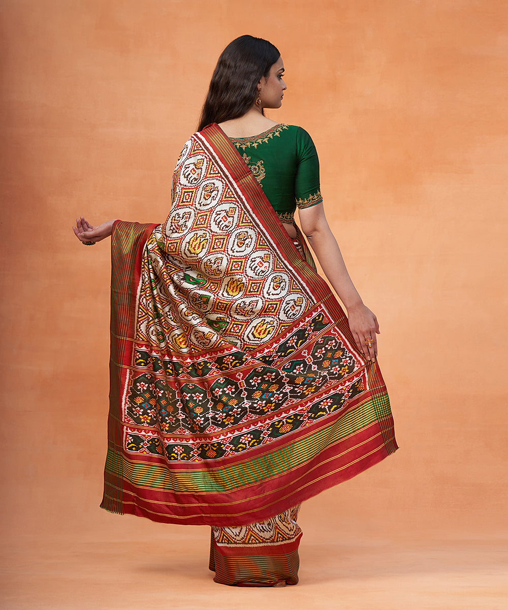 Bottle_Green_And_White_Pure_Mulberry_Silk_Ikat_Patola_Saree_With_Red_Border_WeaverStory_03