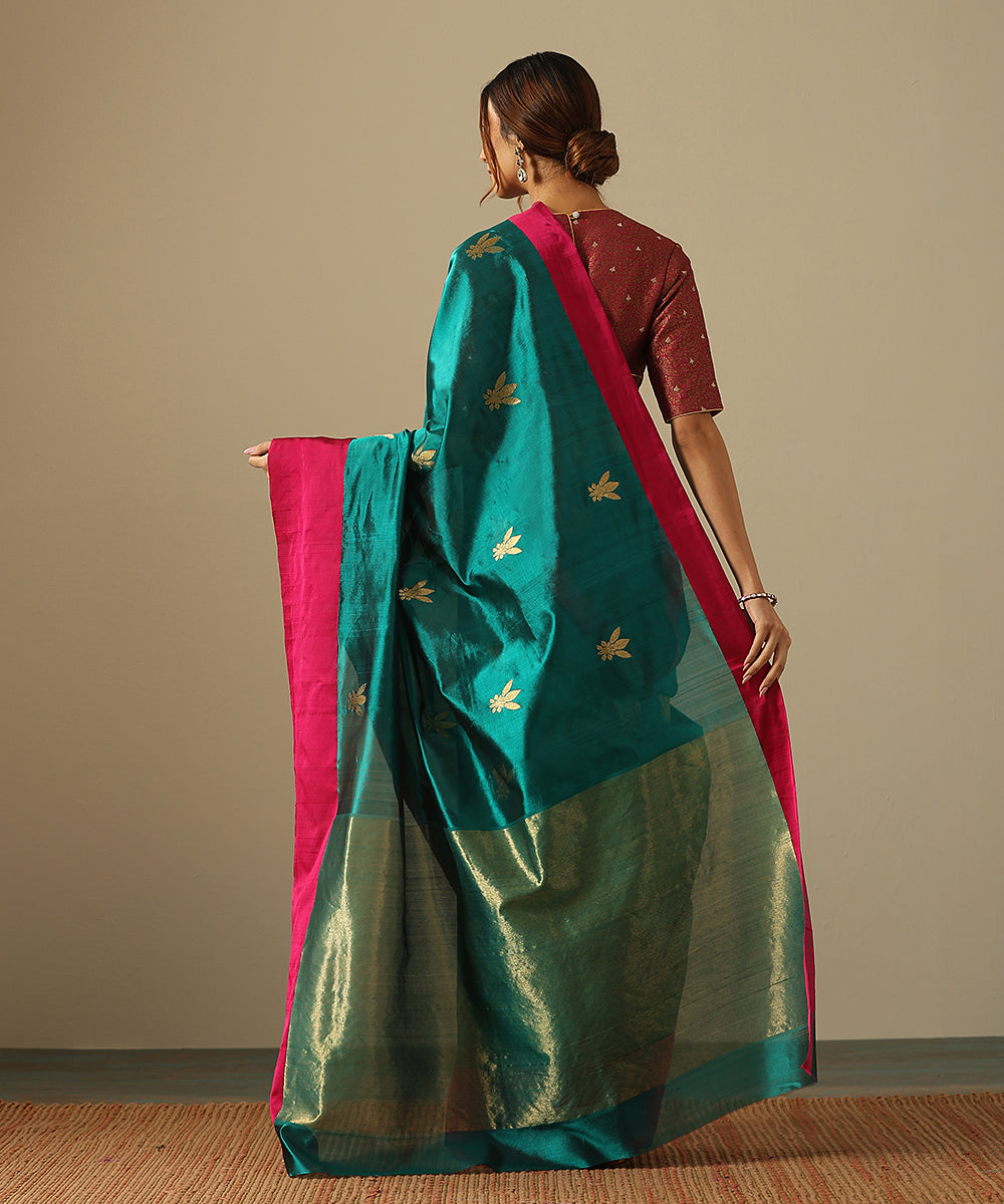 Teal_Handloom_Pure_Chanderi_Silk_Saree_With_Floral_Motifs_And_Pink_Mashroo_Border_WeaverStory_03