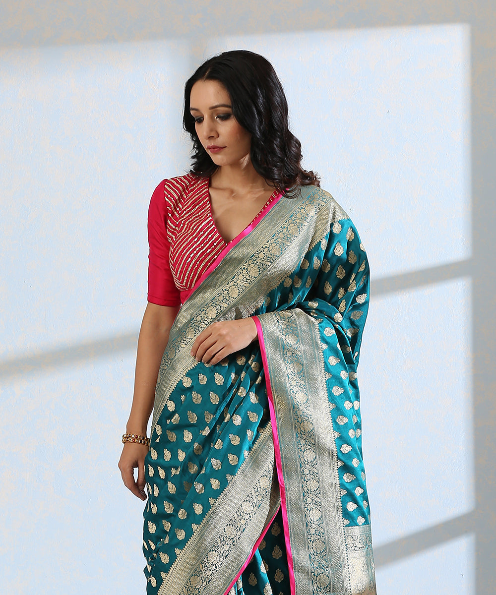 Teal_Blue_Handloom_Pure_Satin_Silk_Banarasi_Saree_With_Booti_And_Floral_Border_WeaverStory_01