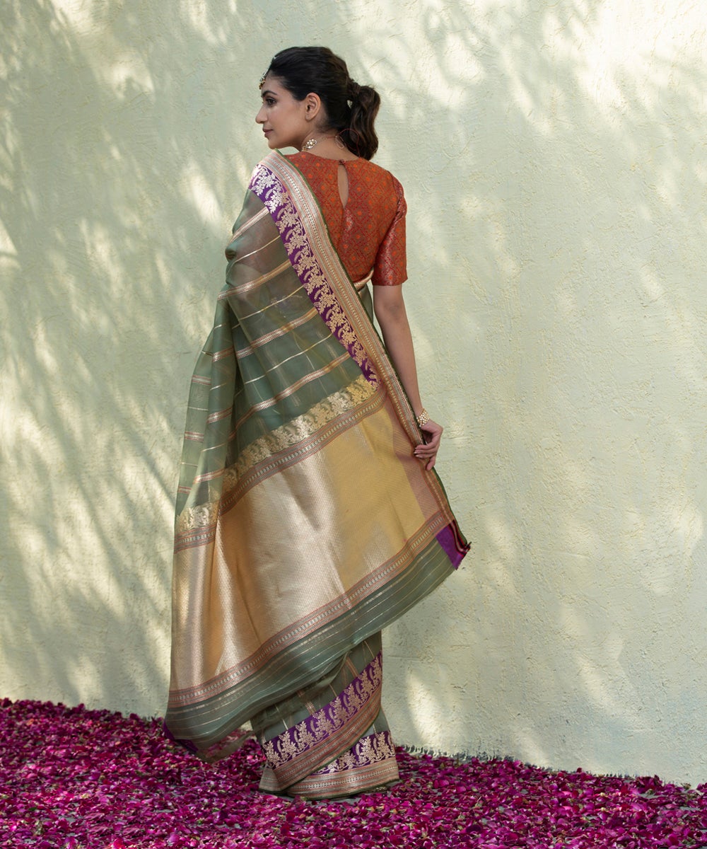 Handloom_Green_Kora_Banarasi_Saree_With_Kadhwa_Zari_Stripes_And_Purple_Floral_Border_WeaverStory_03