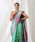 Aqua_Green_Handloom_Pure_Katan_Silk_Banarasi_Patola_Saree_with_Purple_Border_WeaverStory_01