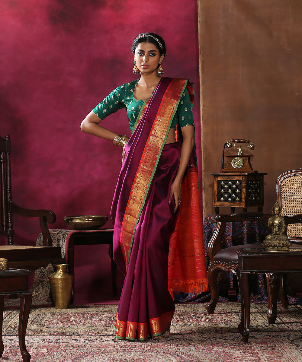 Plum_Handloom_Plain_Pure_Silk_Kanjivaram_Saree_With_Orange_And_Green_Border_WeaverStory_02