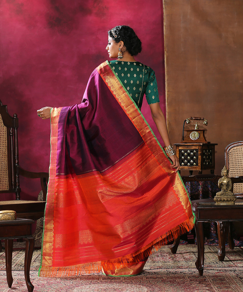 Plum_Handloom_Plain_Pure_Silk_Kanjivaram_Saree_With_Orange_And_Green_Border_WeaverStory_03