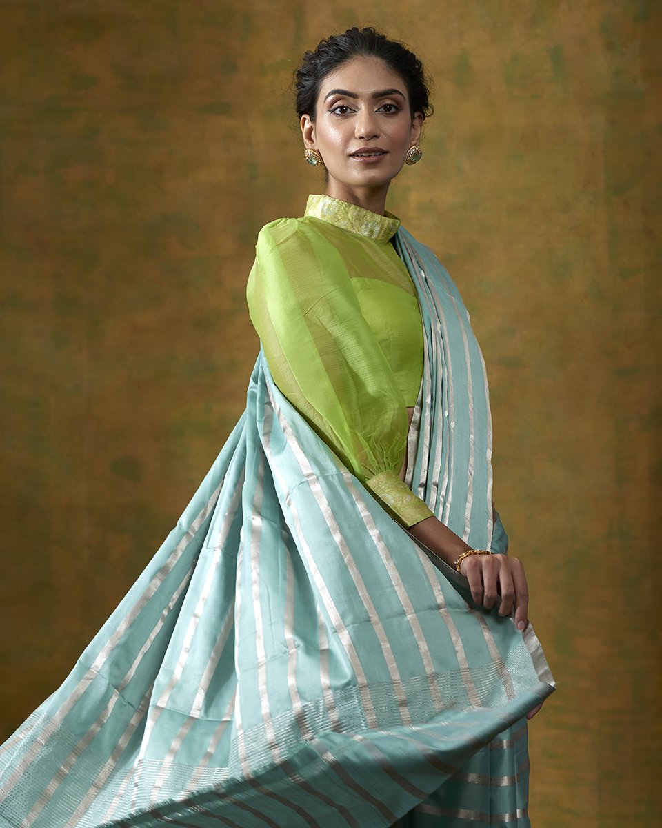 Turquoise_Blue_Handloom_Pure_Satin_Silk_Saree_with_Silver_Zari_Stripes_WeaverStory_01