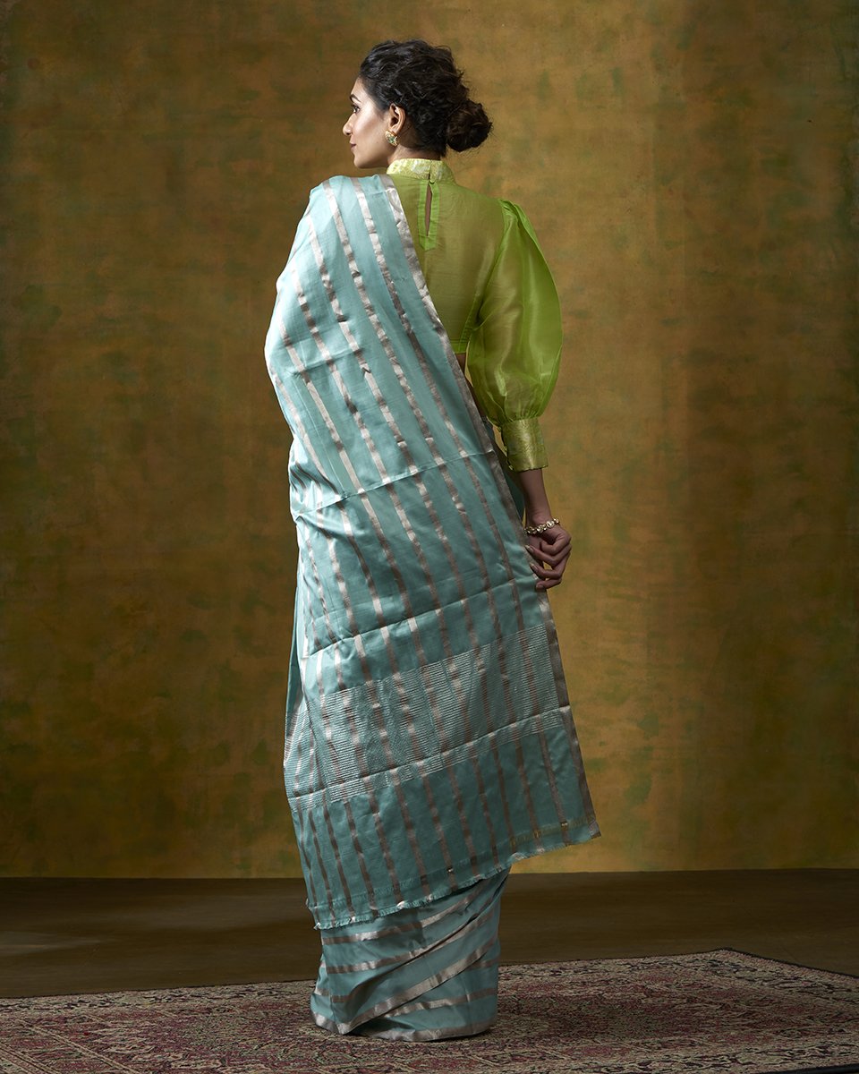 Turquoise_Blue_Handloom_Pure_Satin_Silk_Saree_with_Silver_Zari_Stripes_WeaverStory_03