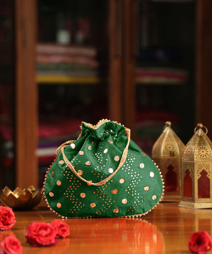 Green_Raw_Silk_Hand_Embroidered_Potli_With_Golden_Big_And_Small_Dotted_Sequin_Work_WeaverStory_02
