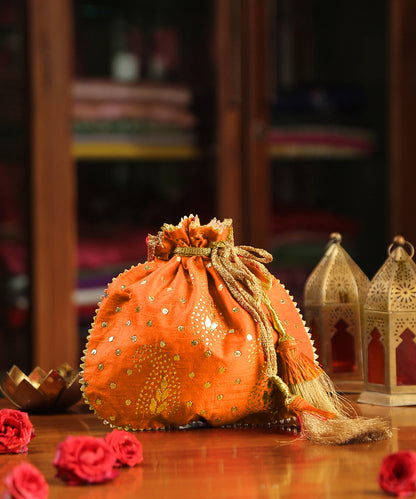 Mustard_Yellow_Hand_Embroidered_Potli_With_Golden_Paisley_And_Sequin_Work_WeaverStory_01