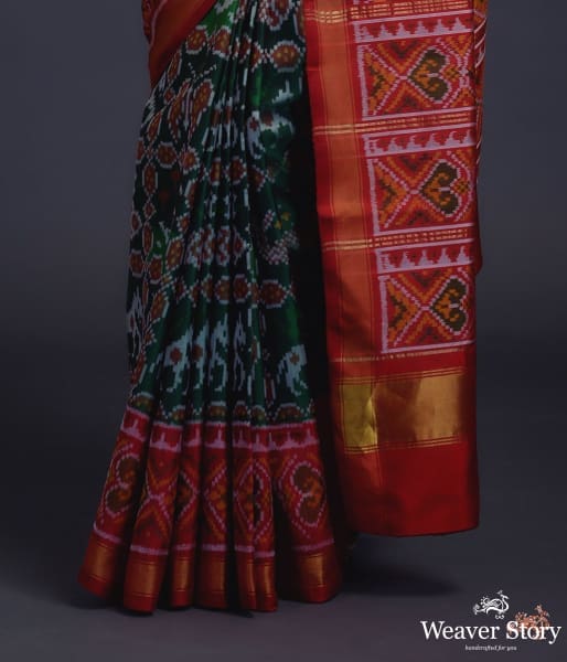 Pure_silk_Gujarat_Patola_saree_in_emerald_green_and_red_with_horse,_swan_and_fish_motifs_WeaverStory_04