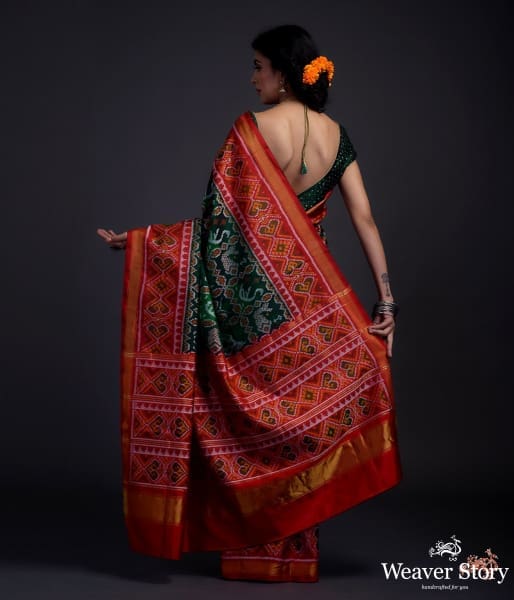 Pure_silk_Gujarat_Patola_saree_in_emerald_green_and_red_with_horse,_swan_and_fish_motifs_WeaverStory_03