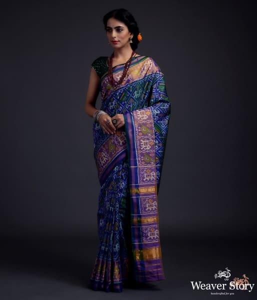 Blue_dual_tone_single_ikat_patola_saree_with_a_purple_and_gold_tissue_border_WeaverStory_02