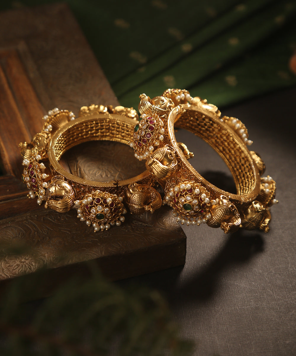Jana_Handcrafted_Golden_Bangles_With_Peacock_And_Floral_Motifs_WeaverStory_01