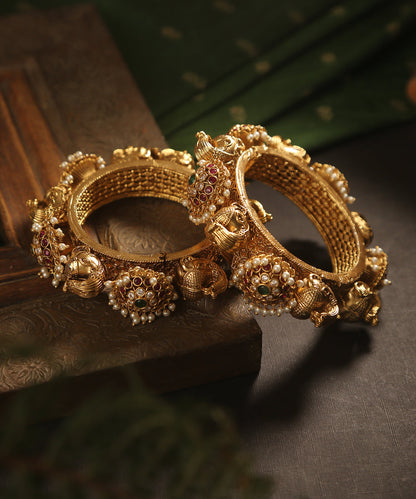 Jana_Handcrafted_Golden_Bangles_With_Peacock_And_Floral_Motifs_WeaverStory_01