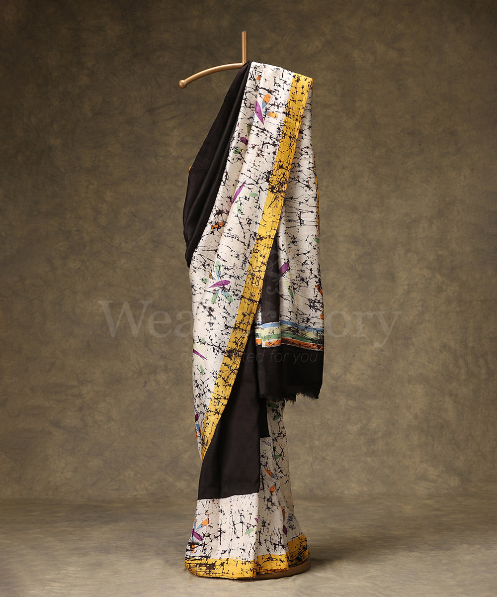 Black_And_Offwhite_Handloom_Hand_Batik_Mulberry_Silk_Saree_With_Yellow_Border_WeaverStory_01