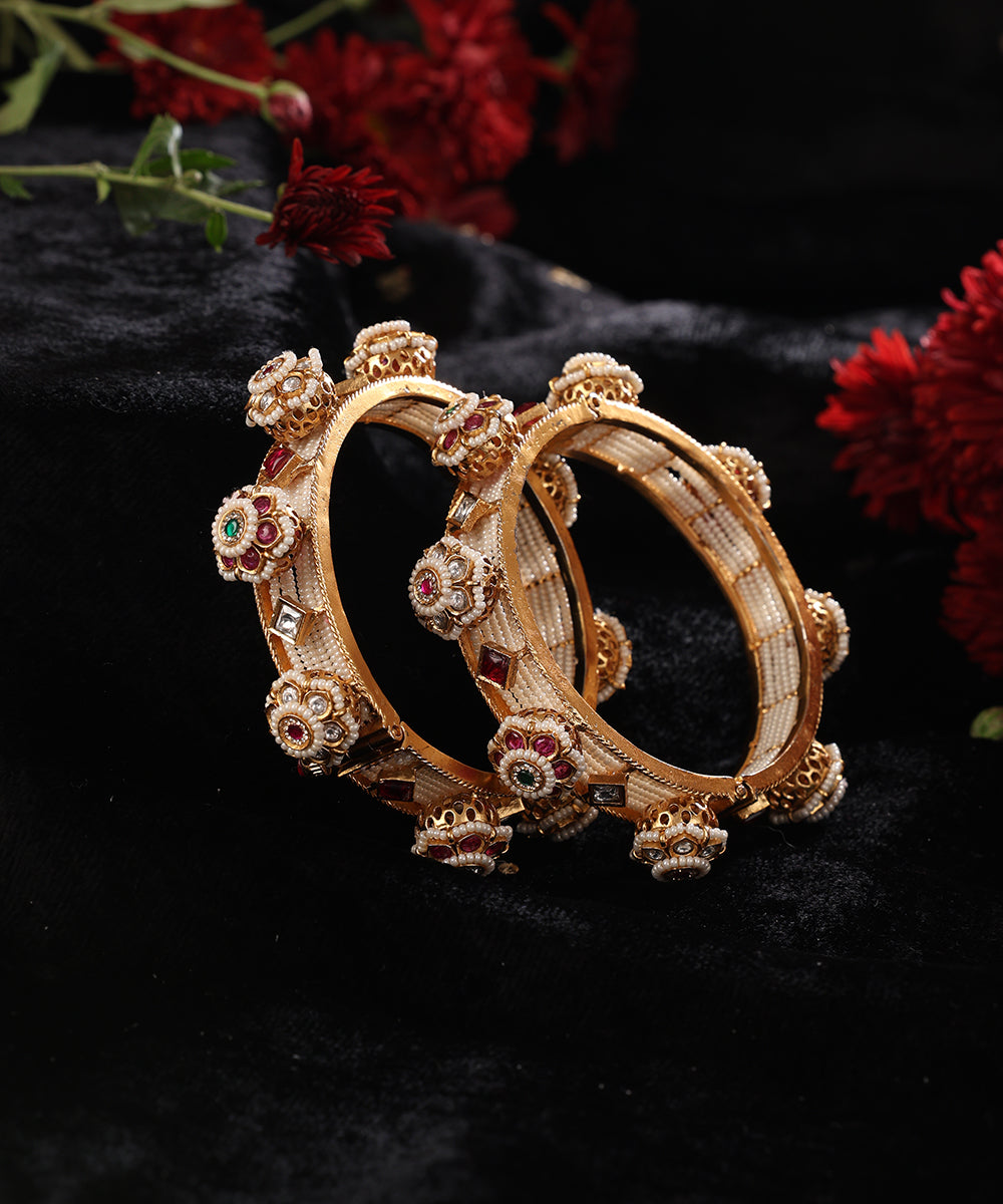 Anaya_Handcrafted_Alloy_Gold_Plated_Bangles_With_Semi_Precious_Stones_And_Pearls_In_Floral_Motifs_WeaverStory_01