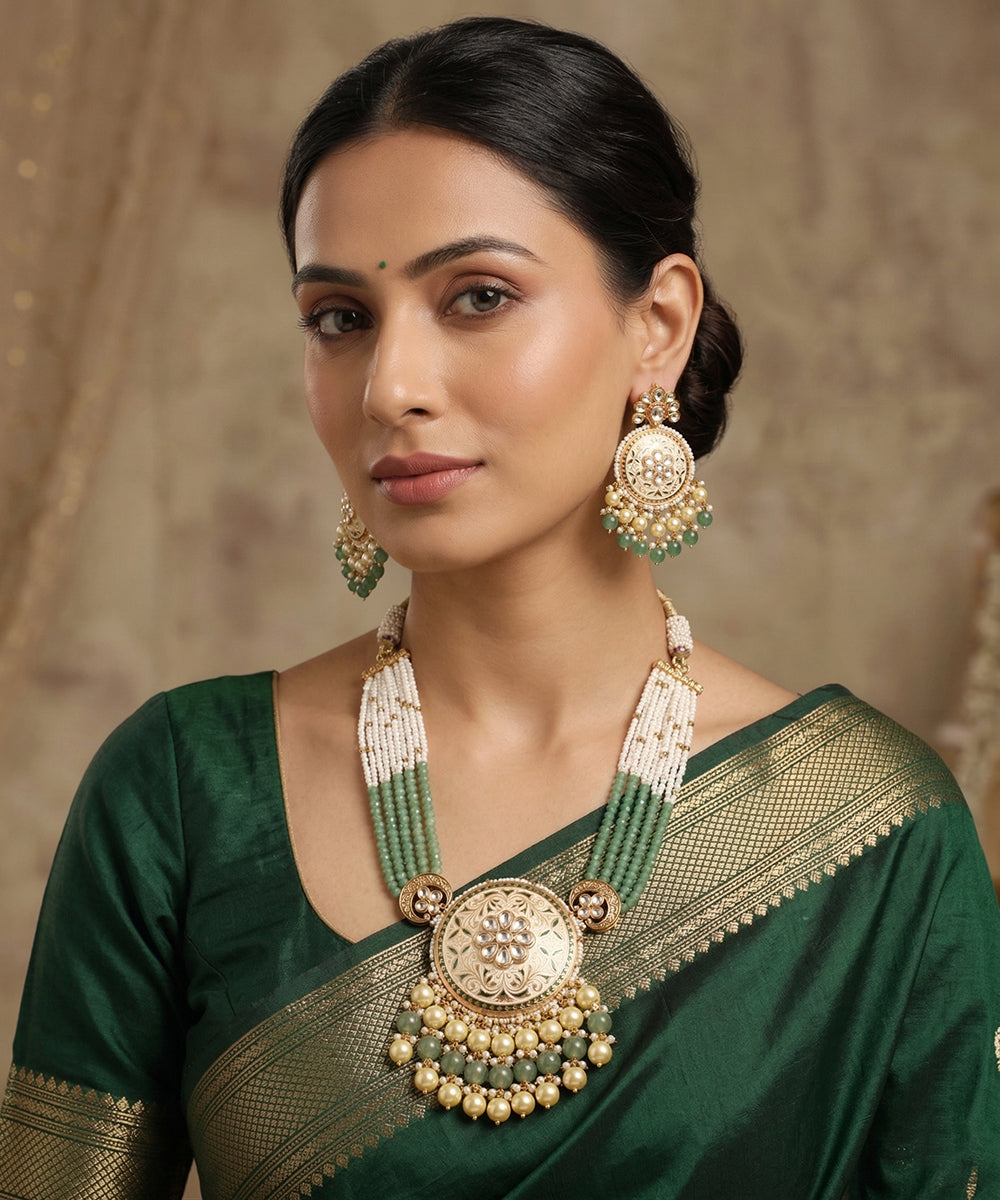Saloni Handcrafted Alloy Gold Plated Necklace Set With Multistring Pearls and Emeralds