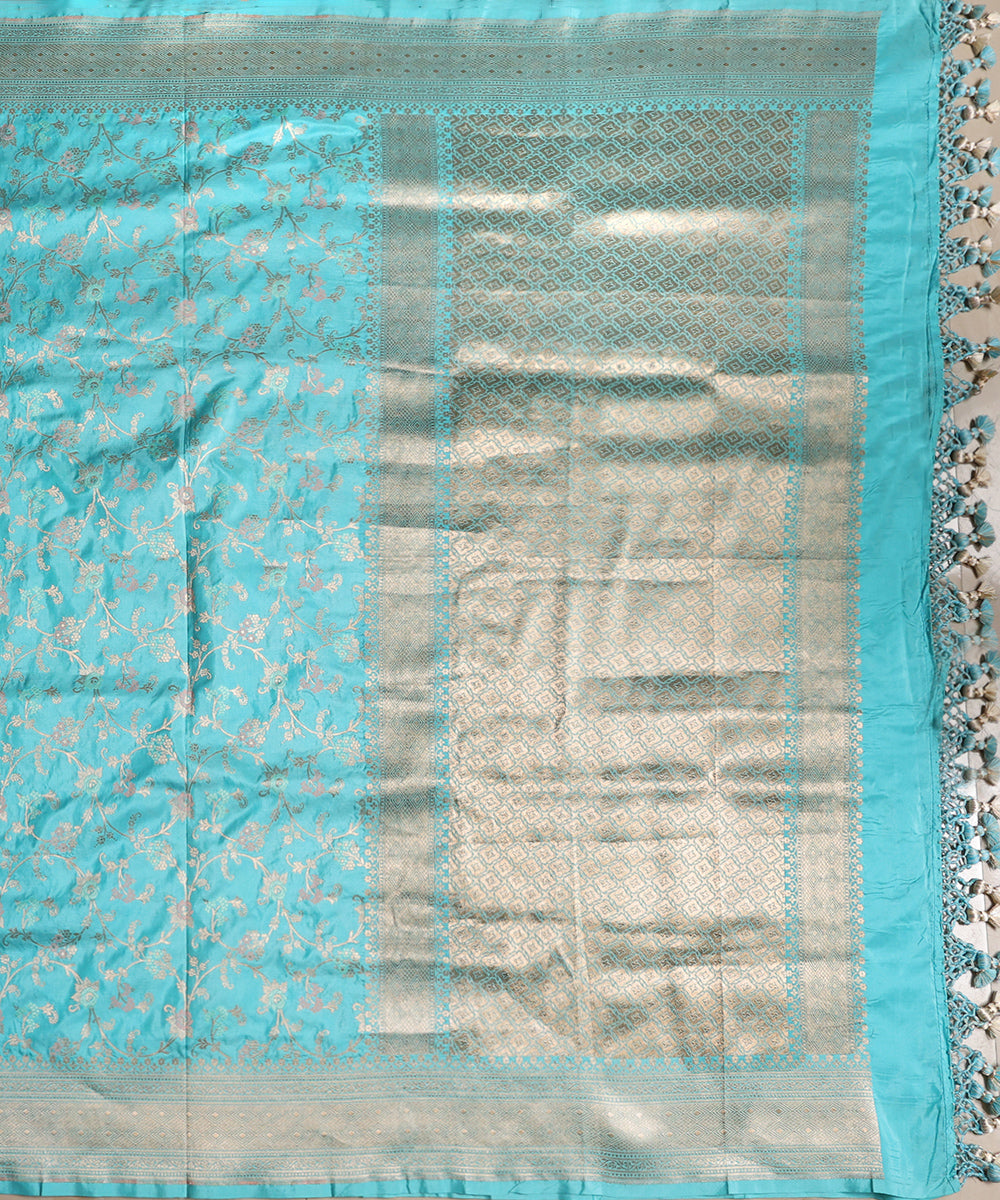 Full view of light turquoise blue handloom Katan silk dupatta featuring zari rose Jangla, meenakari details and an ornate geometric palla.