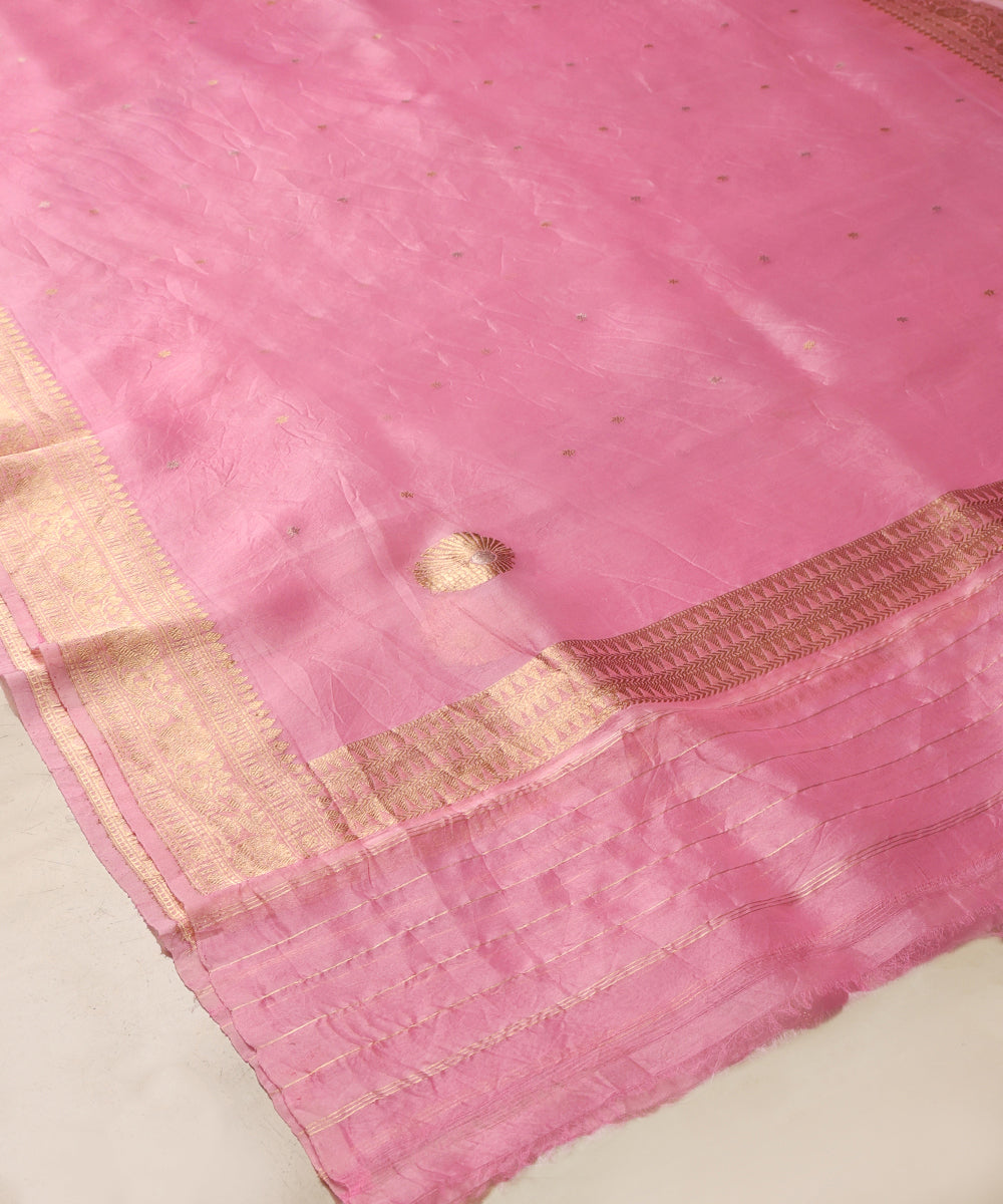 Close-up of pink handloom Kora silk organza dupatta with a circular gold Kadhwa boota, petite zari bootis and woven border.