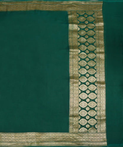 Full view of green handloom Banarasi dupatta with a plain body, gold zari borders and a palla of large floral motifs