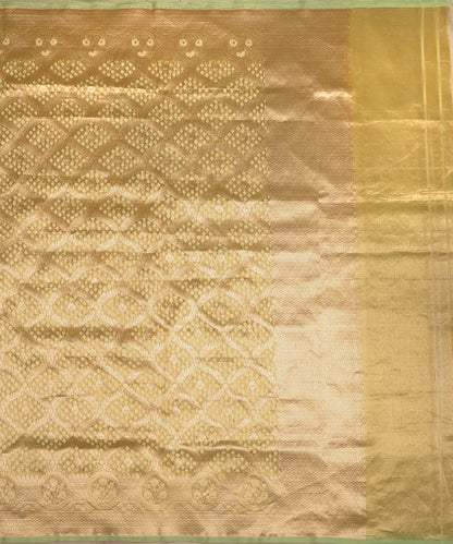 Full view of lemon handloom Kora tissue Banarasi dupatta with a gold diamond Jamdani pattern, floral medallion border and pale-green edging.