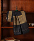 Black pure Katan silk Kadhwa dupatta displayed against a wooden cabinet, showing gold zari leaf bootis and geometric borders.