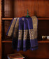 Blue pure Katan silk Kadhwa dupatta displayed against a wooden cabinet, showing gold zari bootis, floral borders and fine palla stripes