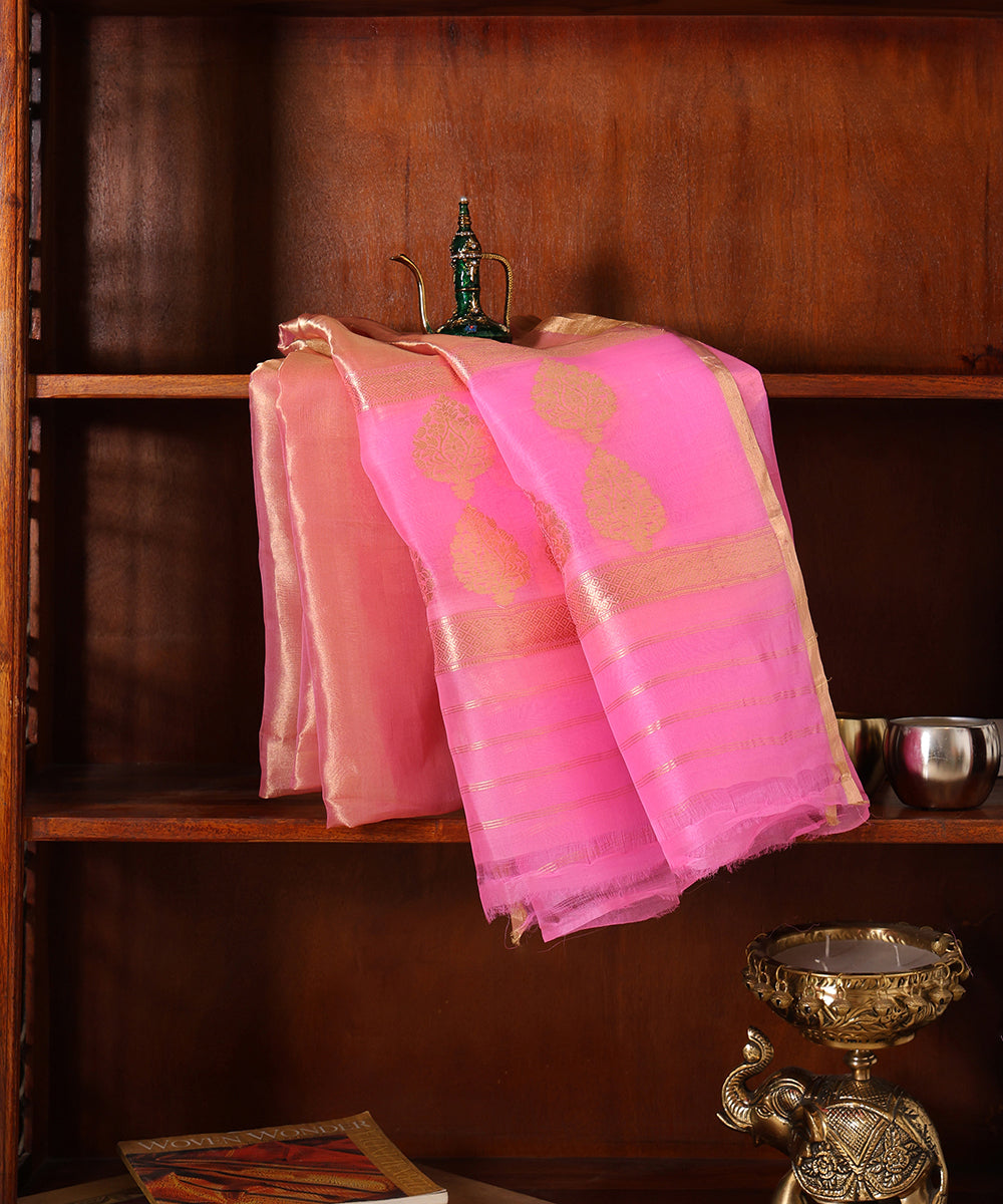 Close-up of pink and gold Banarasi Kora tissue dupatta with large Kadhwa floral bootas, geometric zari borders and striped palla.