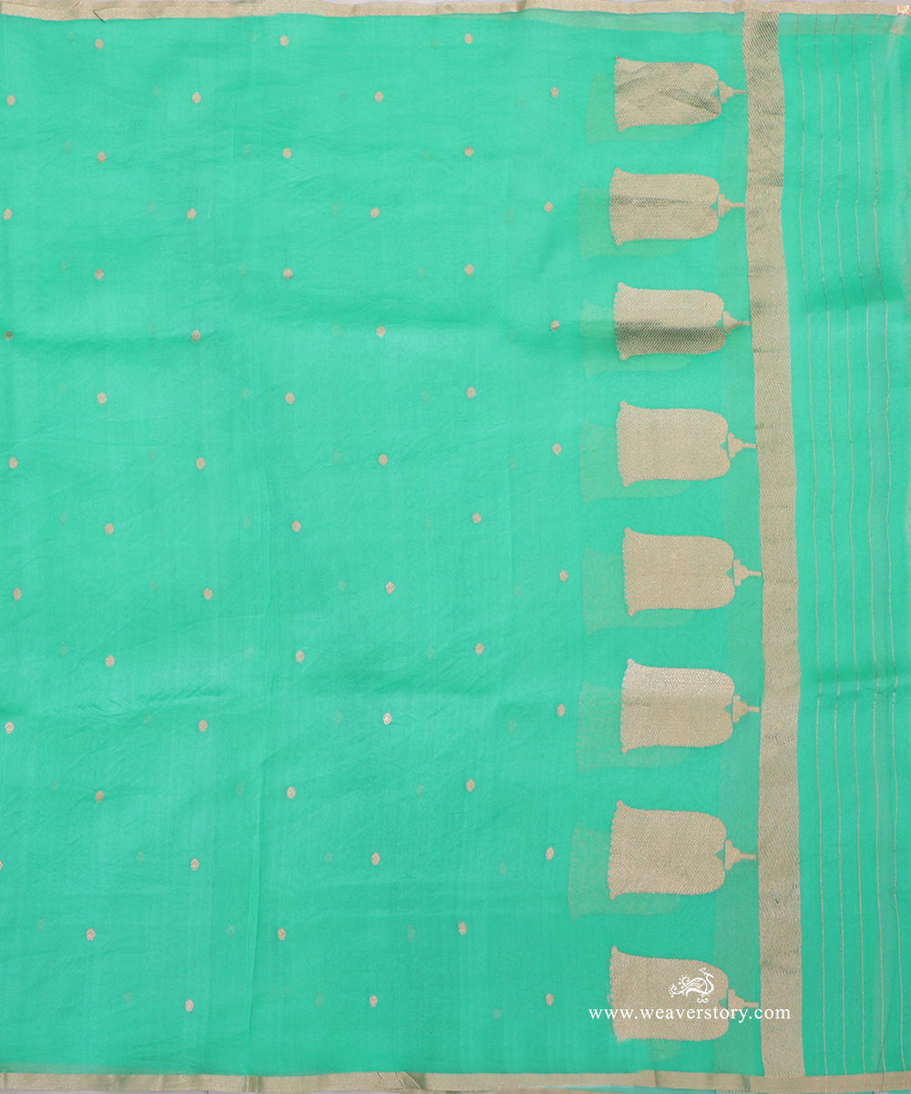Sea green Kora silk dupatta showing scattered circular bootis, a row of gold-toned lotus motifs, narrow metallic edging and striped ends.