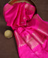 Close-up of gold-toned Kadhwa floral bootis and a floral vine border on a rani pink handloom pure Katan silk dupatta.