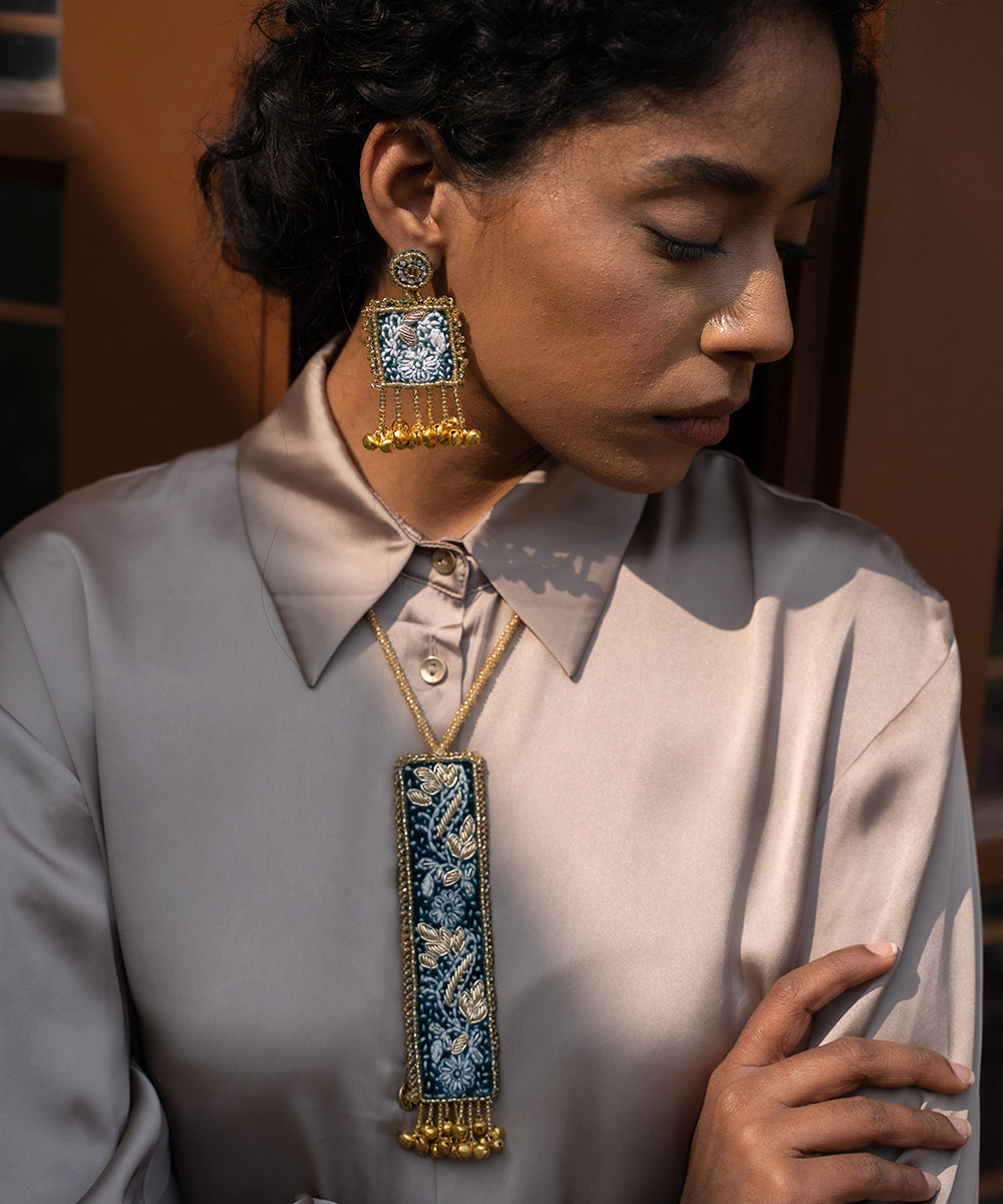 Hand-Embroidered_Blue_Floral_Beaded_Jhumka_Earrings_With_Gold_Bell_Drops_WeaverStory_02