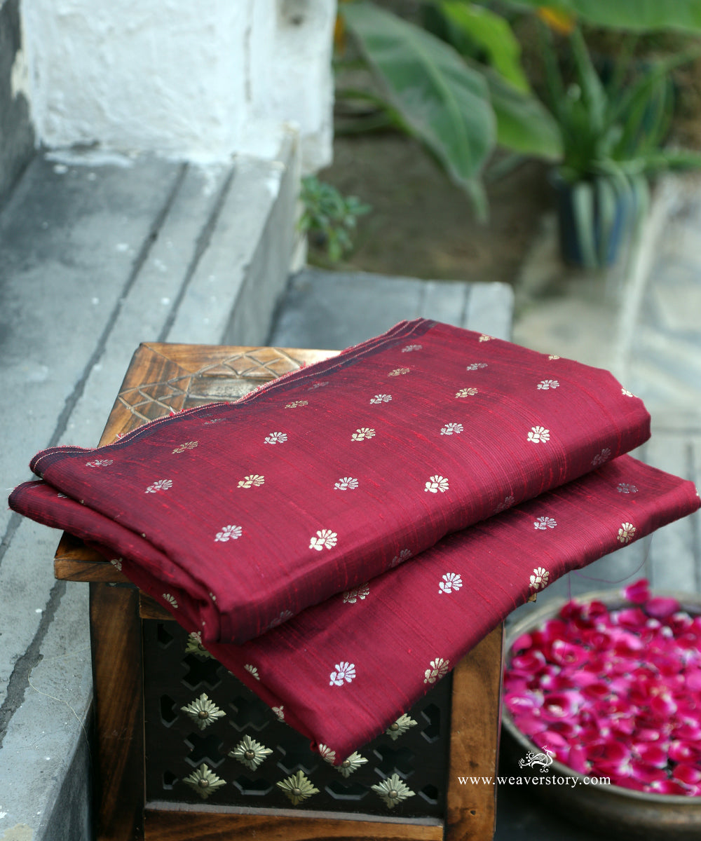 Maroon_Handloom_Pure_Raw_Silk_Banarasi_Fabric_With_Small_Gold_And_Silver_Zari_Booti_WeaverStory_01