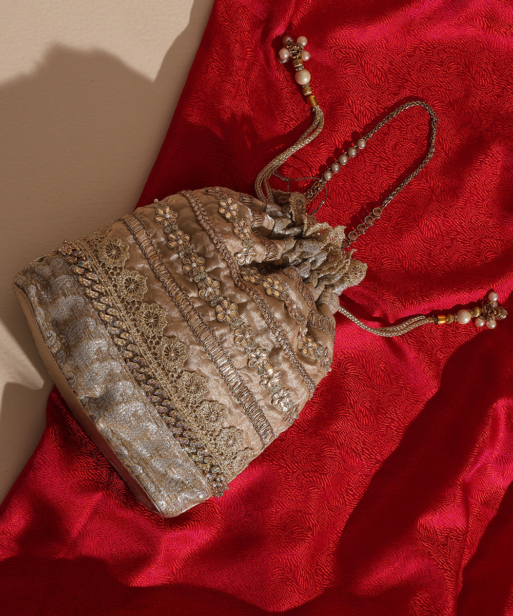 Beige Lame Glass Tissue Potli With Golden Lace Embroidery