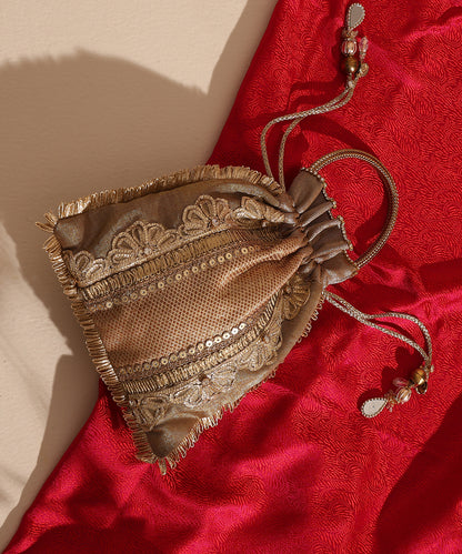 Beige Brocade Potli With Vertical Lace Stones And 3 Gold Panels