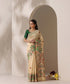 Model wearing a lemon yellow handloom Chanderi saree with Madhubani parrot borders and an intricate painted pallu