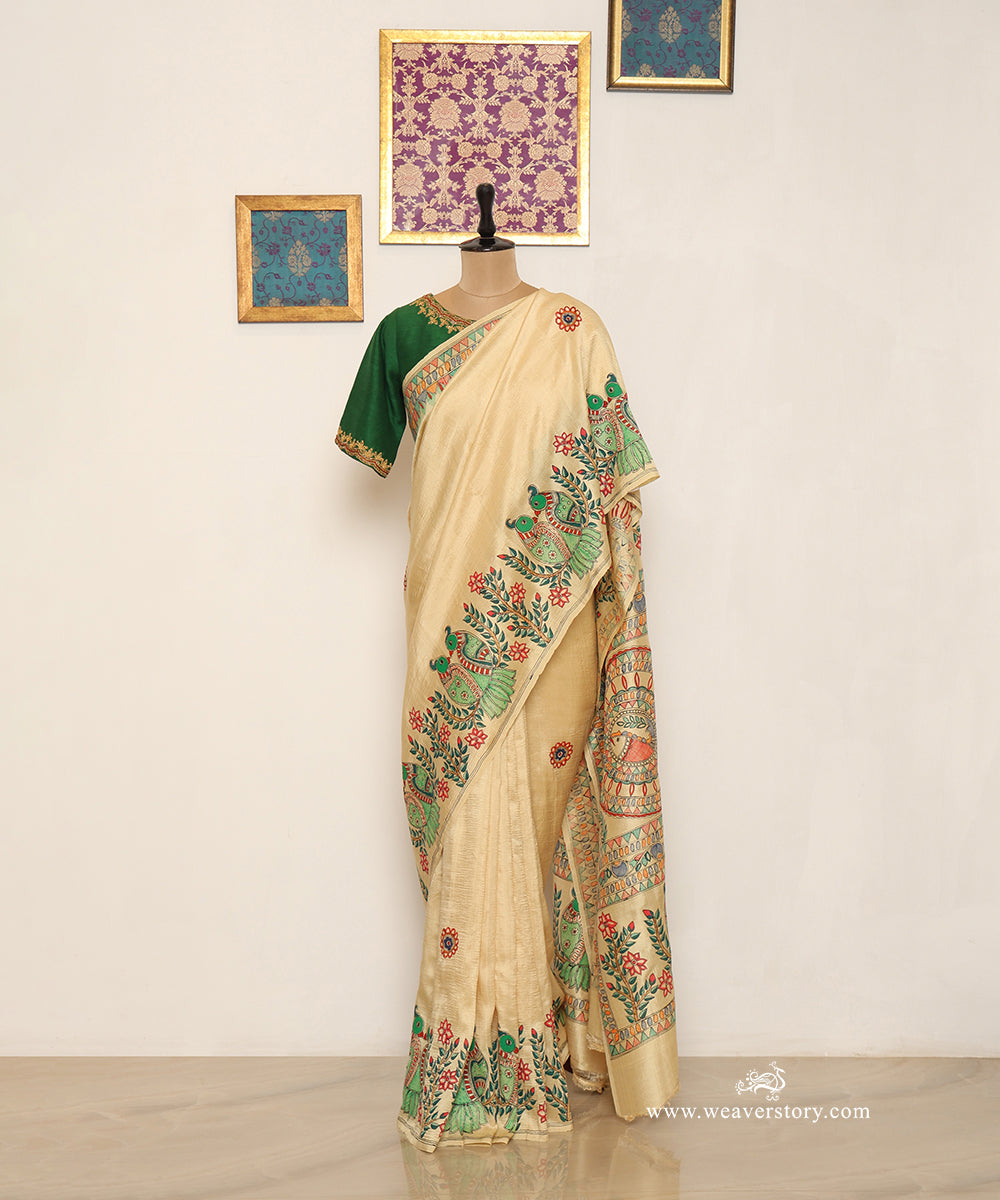 Full drape of lemon yellow Chanderi saree with paired green parrots along the border and scattered floral motifs.