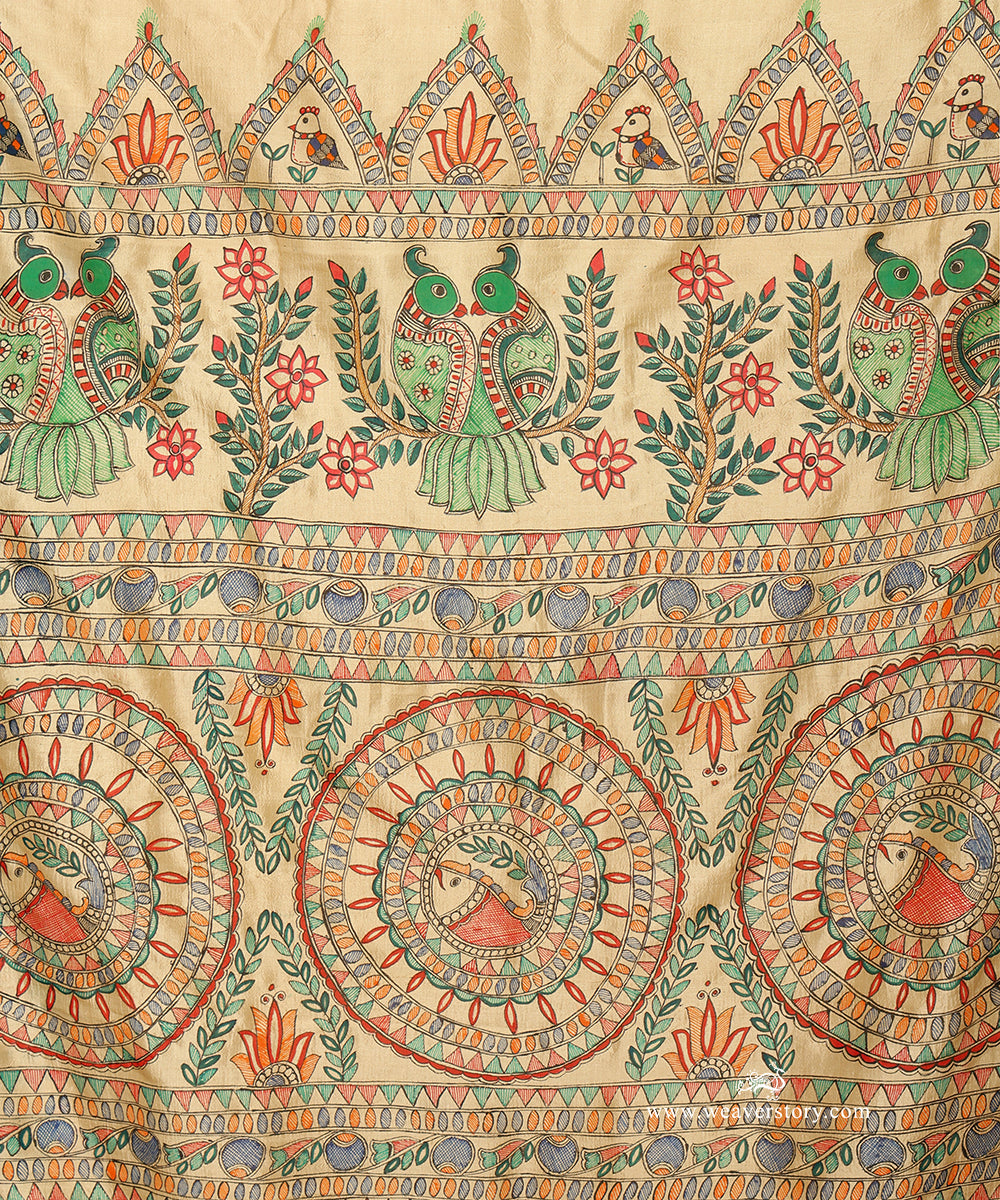 Close-up of bamboo-pen detailing in paired parrots, circular bird panels and multicoloured pallu borders.