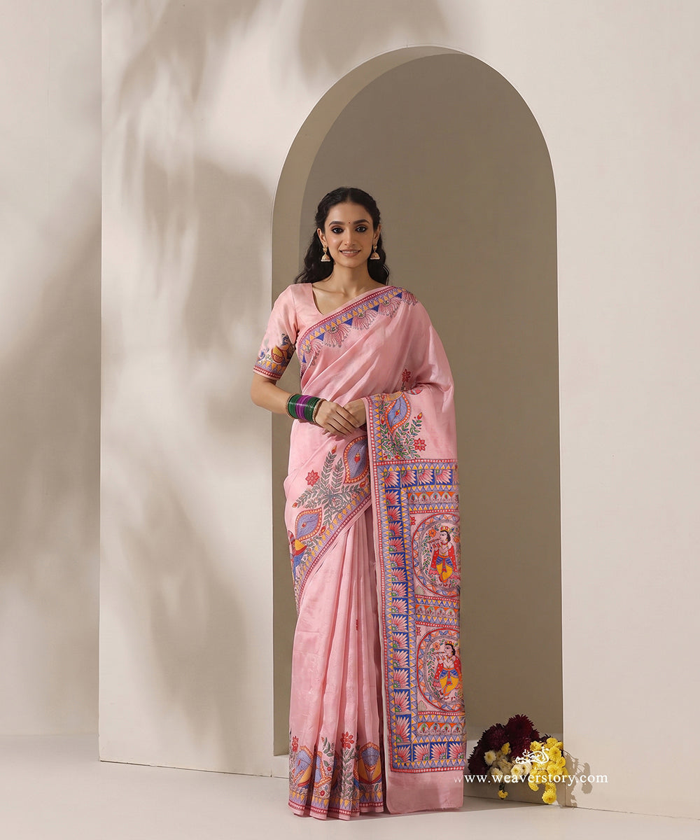 Model wearing a light pink handloom Chanderi saree with a Madhubani Krishna pallu and painted bird borders.