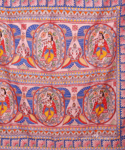 Close-up of the Madhubani Krishna pallu showing fine bamboo-pen work and rich blue, red and yellow details