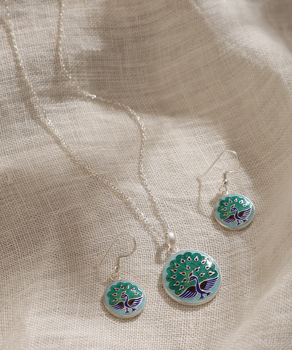 Baani_Blue_And_Green_Handcrafted_Pure_Silver_Meenakari_Pendant_And_Earrings_Set_With_Peacock_Motif_WeaverStory_01