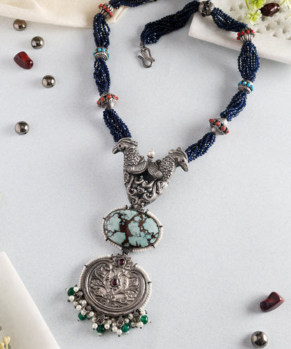 Bhuvika_Turquoise_Handcrafted_Oxidised_Pure_Silver_Necklace_With_Parrot_Motif_WeaverStory_01