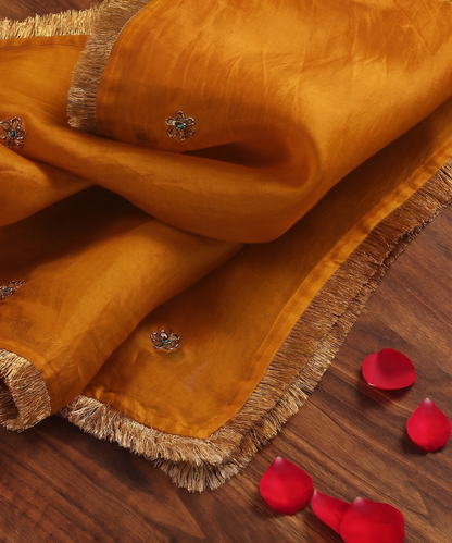 Mustard handloom silk organza dupatta with scattered zardozi floral motifs, turquoise meenakari accents and handcrafted metallic gold kiran edging.