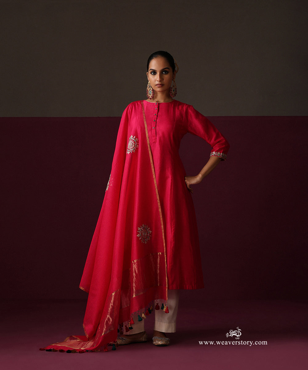 Model wearing Inaya, a hot pink Chanderi suit with rangoli boota dupatta and ivory straight pants