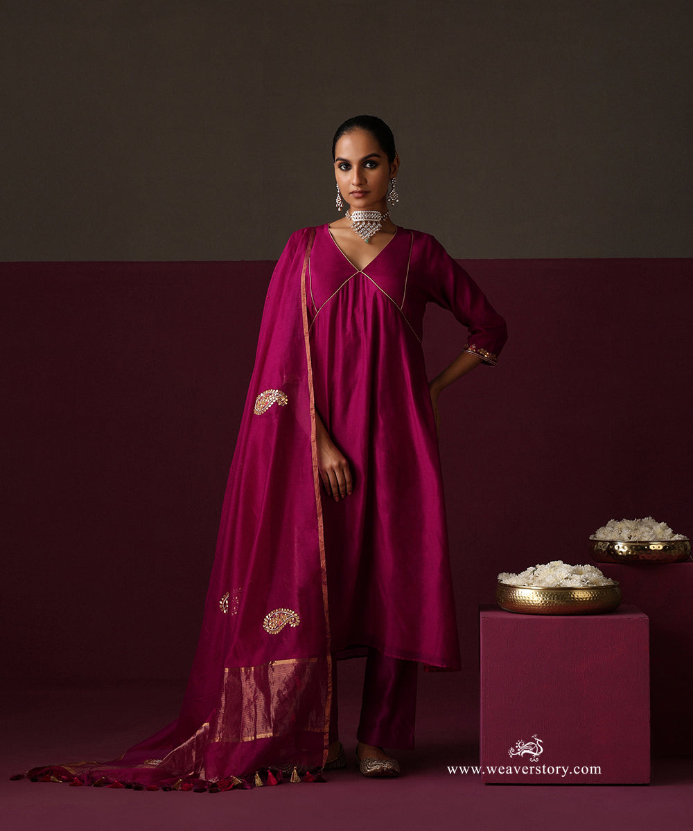 Model wearing Ambreen, a deep magenta Chanderi suit with panelled kurta and gota patti ambi dupatta