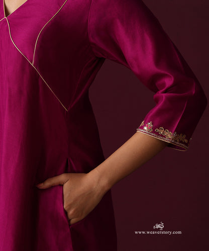Close-up of the gold-piped bodice panels and floral hand embroidery at the kurta cuff