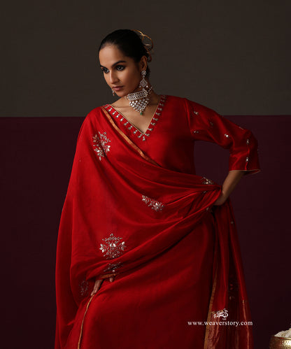 Full-length view of the blood red Chanderi suit with floral embroidered dupatta and gold tissue border