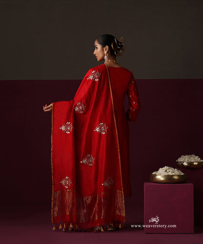 Back view of the blood red Chanderi dupatta with spaced floral bootas, gold border and tassels